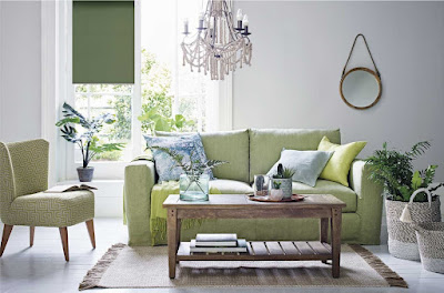 Green armchair, sofa, and wooden table