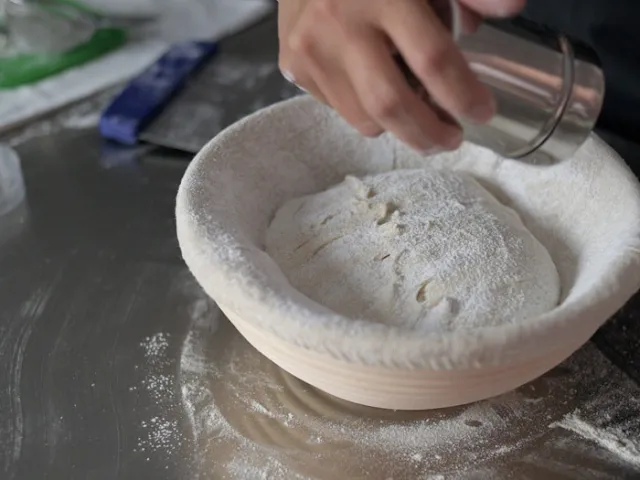 Transfer to banetton, seam side up and sprinkle more rice flour.