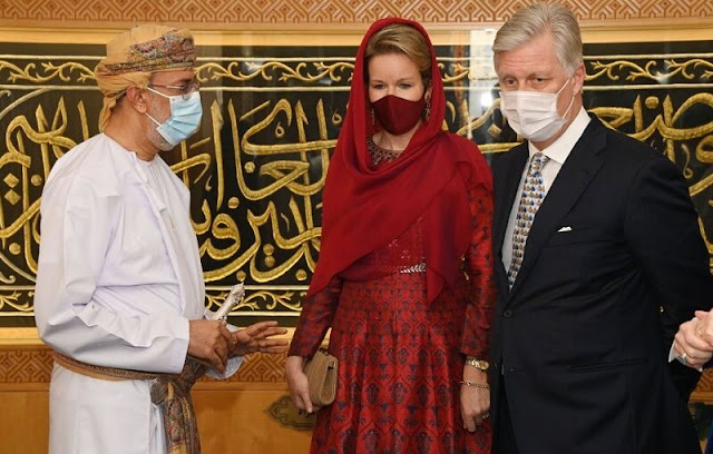 Queen Mathilde wore a red printed dress by Dries Van Noten. Sultanate of Oman and the United Arab Emirates