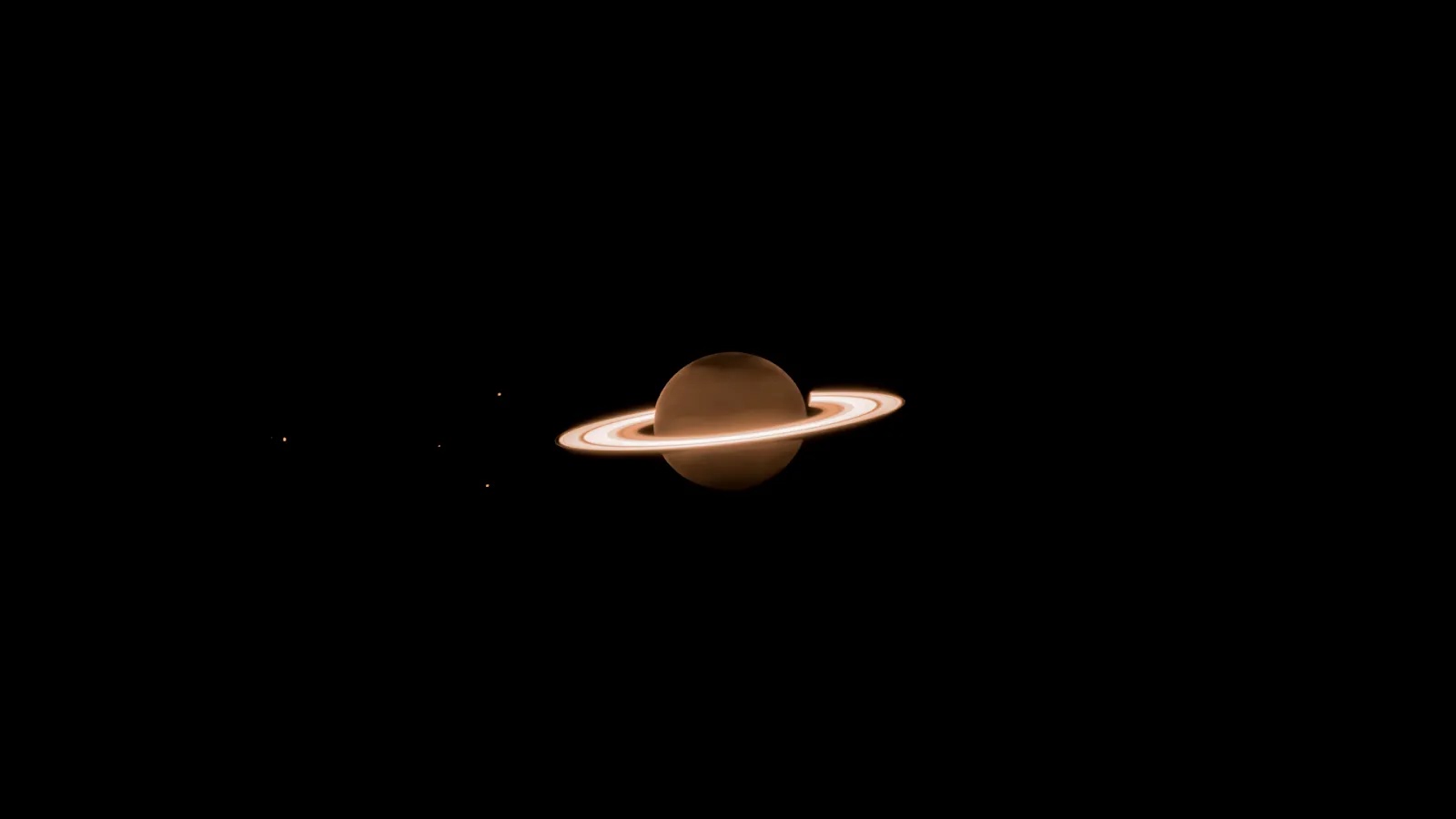 A serene image of Saturn with its iconic rings against the vast blackness of space.