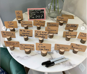 table of small tree stumps with cards