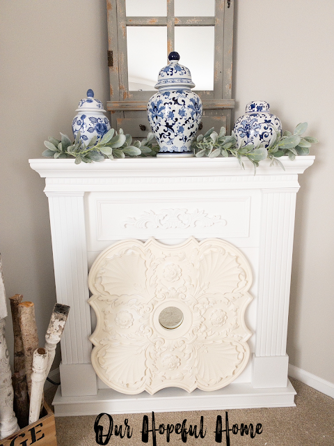 white fireplace chinoiserie ginger jars ceiling medallion with mirror