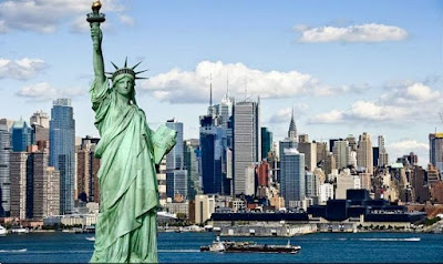 Photograph of the New York skyline prominently featuring Lady Liberty