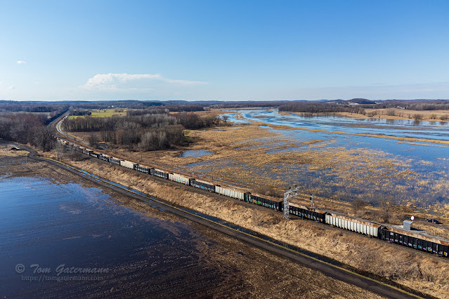 Q634-18 stretched well close to mile and a half to the west of CP320. Crusoe Creek is in the background following a similar curvature as the train tracks