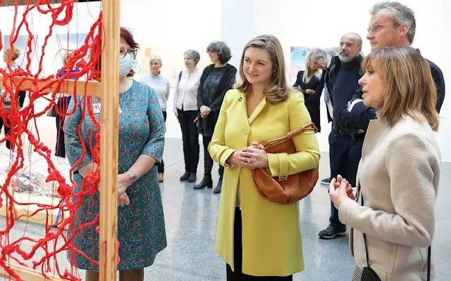 Princess Stephanie wore a yellow wool double breasted coat with metal buttons by Tara Jarmon