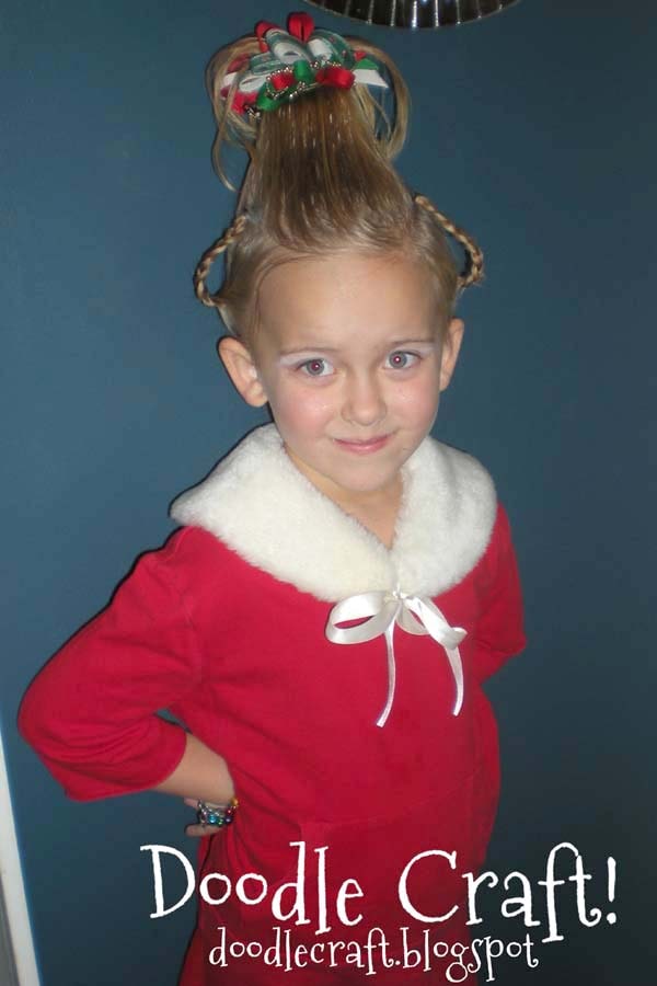 The first year we tried this fun hairdo was 2009, my daughter was 5 and absolutely loved all the attention she got at the Christmas party.   Her hair was pretty fluffy and light, but it still worked great for the Cindy Lou Who Hairdo. This hair style would be really fun to do with long hair!