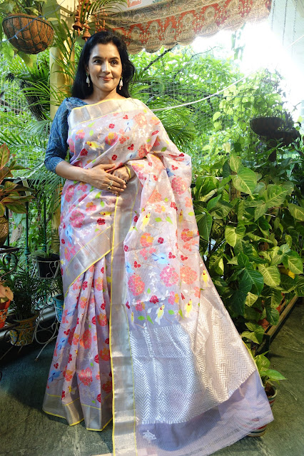 Gorgeous mauve saree with multicolor fluorescent birds and flowers.