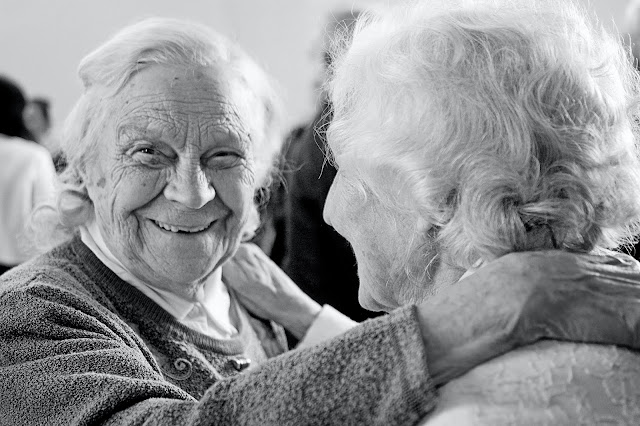 Two older people smiling:Photo by Artyom Kabajev on Unsplash