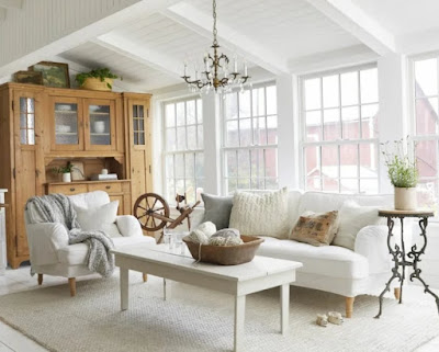 White wooden coffee table, comfy sofa, and armchair