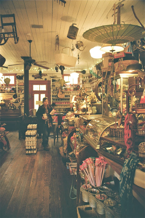 Interior view of an old time style general store, located in Rabbit Hash KY.  Shelves and counters jammed with merchandise.