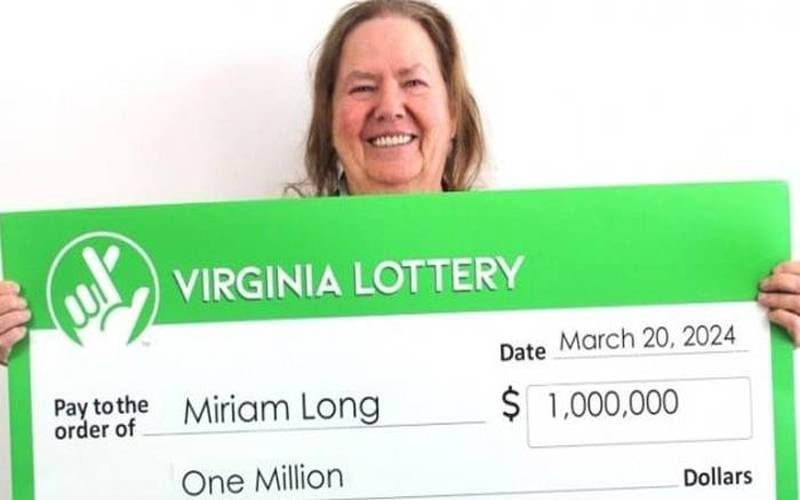 Woman wins $1 million after pressing wrong button