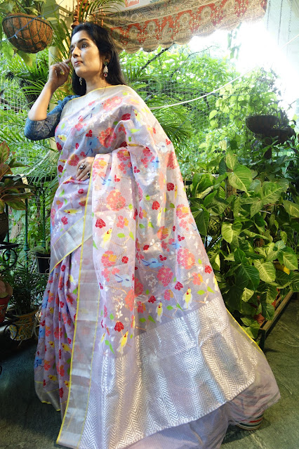 Gorgeous mauve saree with multicolor fluorescent birds and flowers.