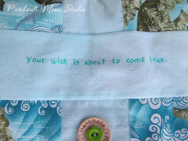 Close up of quote written on purse flap