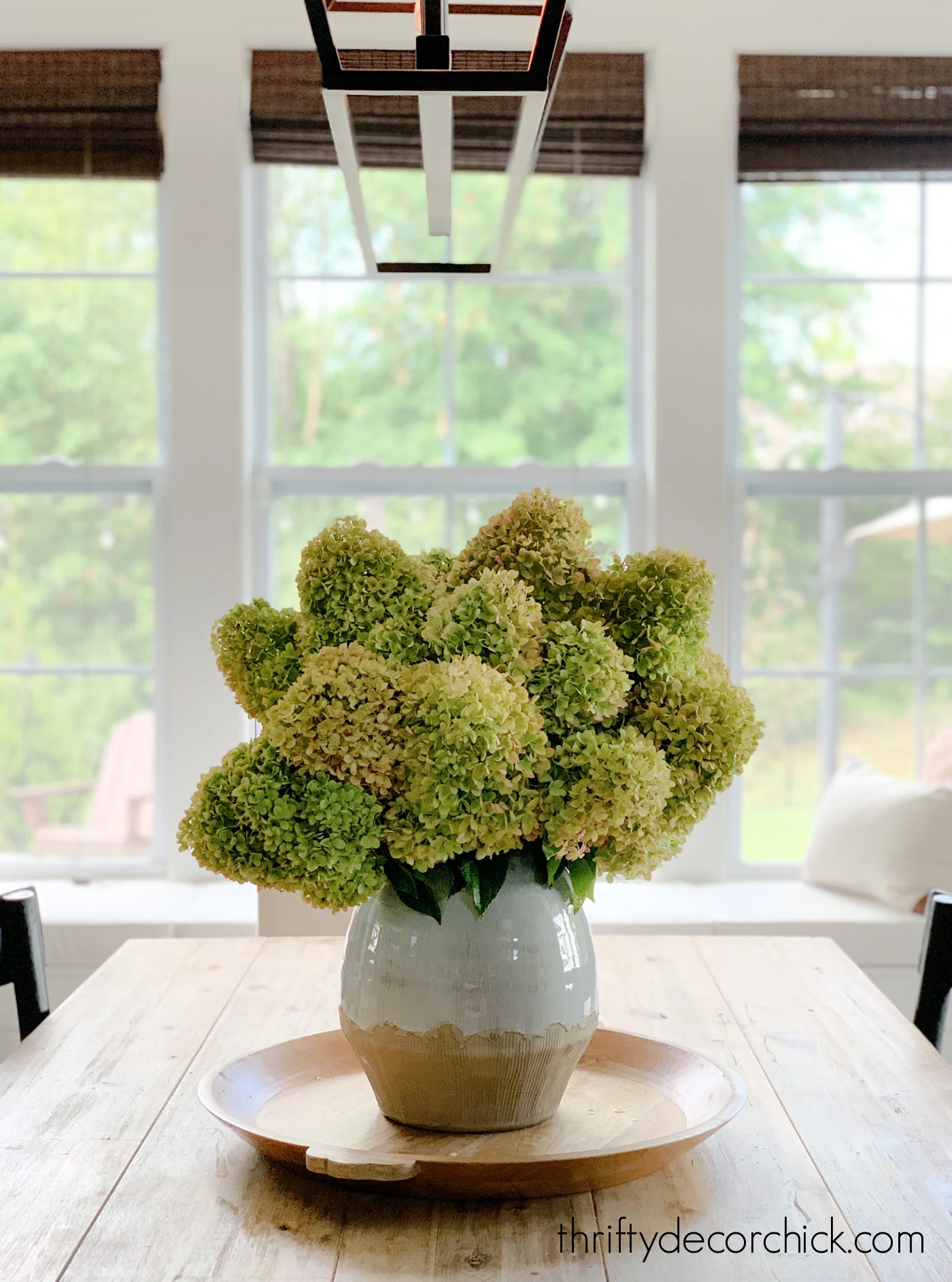 huge green hydrangea vase on table