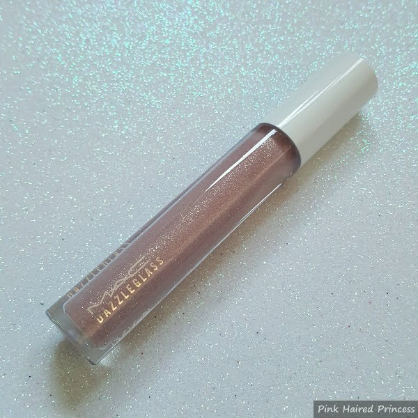 MAC Dressed To Dazzle Dazzleglass lipgloss on glitter background