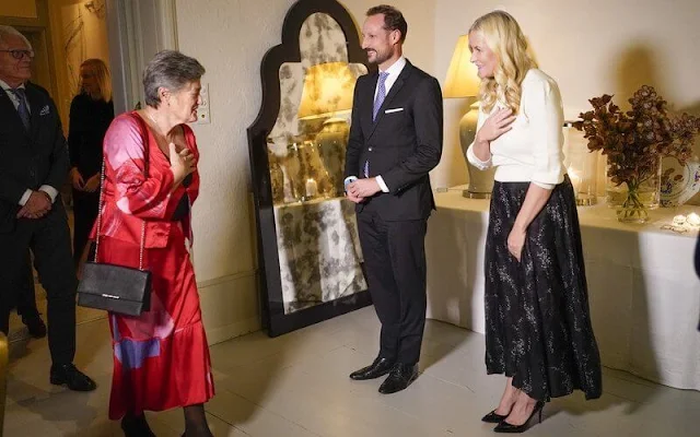 Crown Princess Mette-Marit wore a linen and silk skirt from H&M Conscious Collection, and white wool sweater from CO