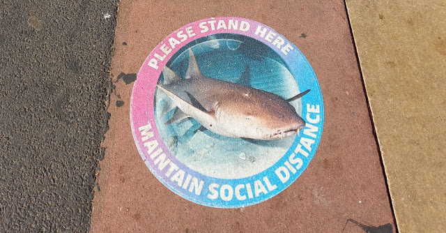 Social distancing sign at the SEA LIFE centre in Blackpool