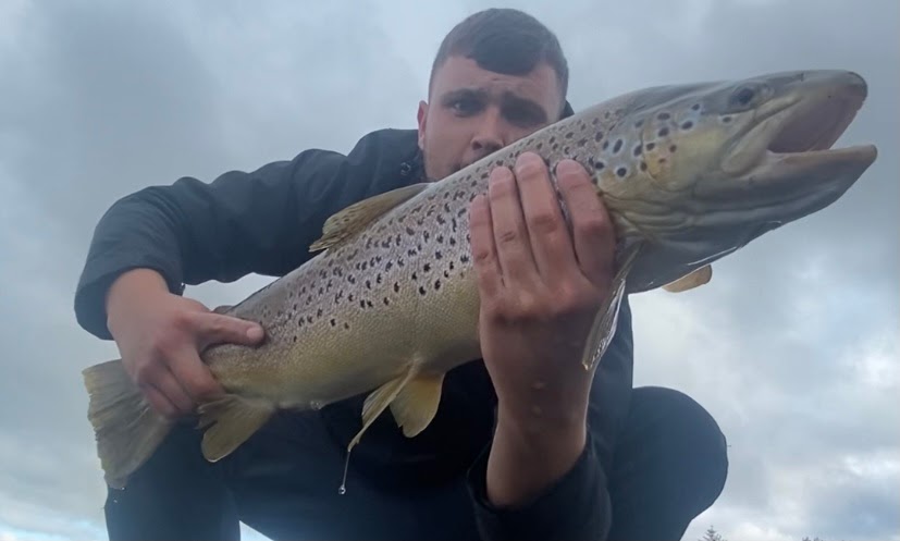 Robbie watson - Brown Trout caught while targeting perch on a 7.5cm shad on an ultra light setup, struggle to fit it in his net!!