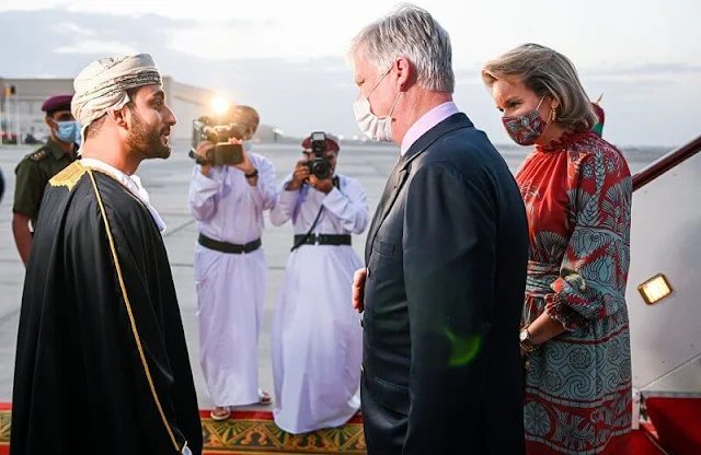 Queen Mathilde wore a new multi ataraxia ruched crepe dress from Johanna Ortiz. The Sultanate of Oman and the United Arab Emirates