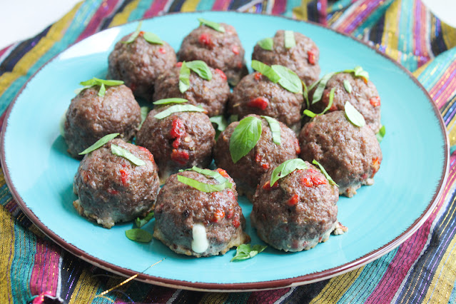Food Lust People Love: These Pepperoni Pizza Meatballs are seasoned with Italian herbs, onion, garlic, anchovies and sun-dried tomatoes then they are stuffed with pepperoni and mozzarella. Delicious!