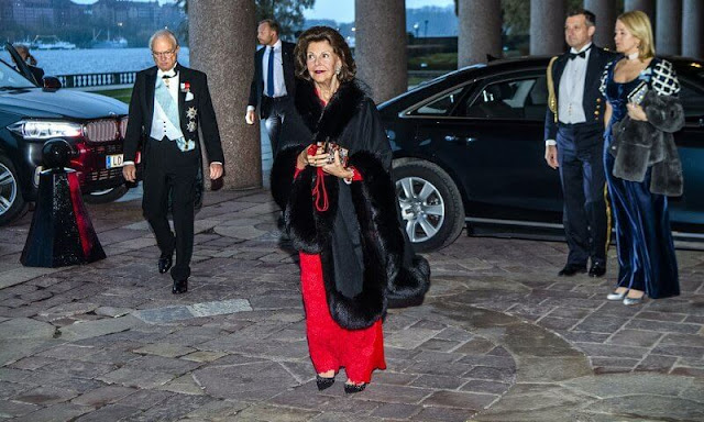 Royal Swedish Academy of Engineering Sciences. Queen Silvia wore a red lace dress. Van Cleef and Arpels flower earrings