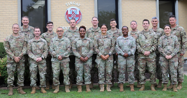 Duval, pictured first row, fourth from the left, poses for the 2021 class photo. (Photo credit: Capt. Rachel Duval)