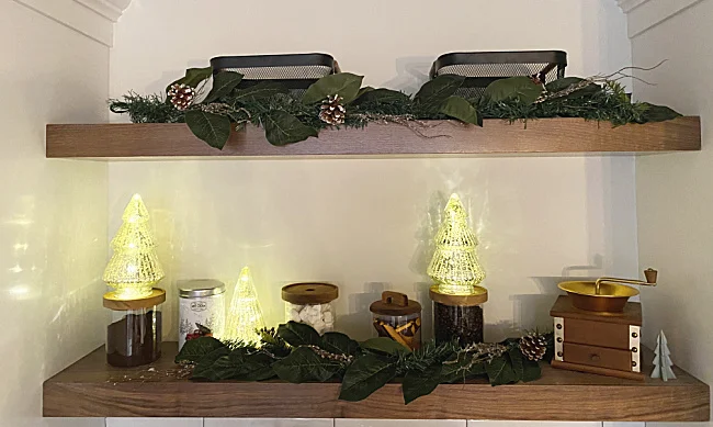 garland on coffee bar with lighted mercury glass trees