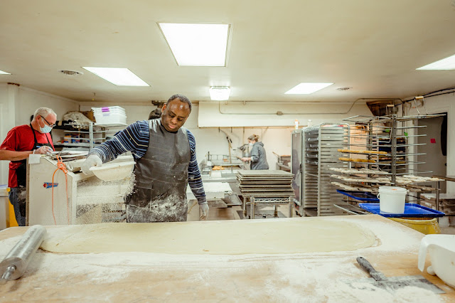 Tadough's Kitchen Managers Scott and Kevin help produce over 3,000 donuts a day.