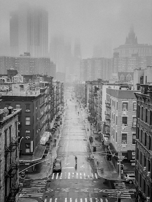 aerial view of lone person on a street in New York City's Chinatown in March, 2020 early in the Covid pandemic lockdown