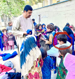 Haji Sayed Ahmad Selab, Ex Afghan MNA And Social Worker Busy In Relief Activities. Distributing Shawls And Sweaters among Children.