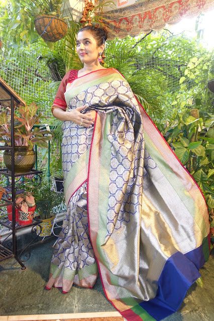 Banarasi saree with vintage vibes- all over zari.  Blue with red and green border