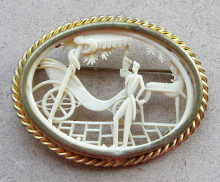 French Depose celluloid brooch with horse and carriage