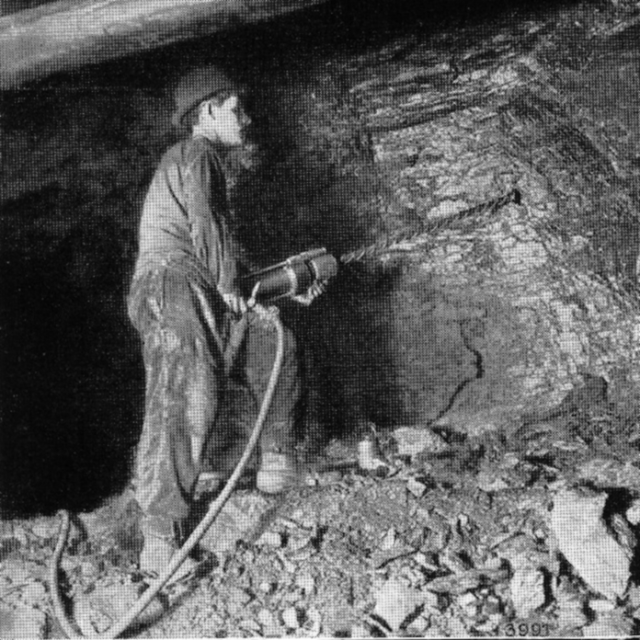 black-white-miner-drilling