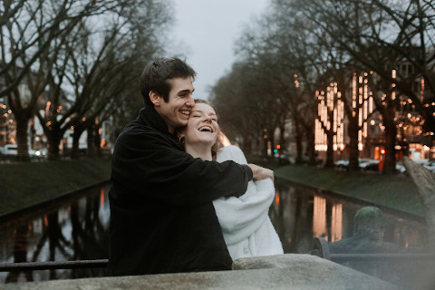 A couple hugging on the bridge