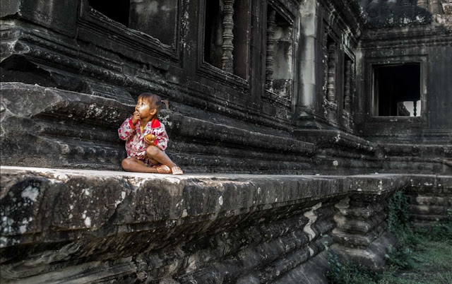 “Little Cambodian girl at an ancient temple at Angkor Wat”. Siem Reap, Cambodia. © Ishu Patel