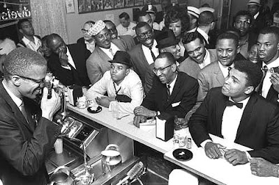 Black Muslim Leader Malcolm X Photographing Cassius Clay Surrounded by Fans After He Beat Sonny Liston for the Heavy Weight Championship, Miami, February 1964