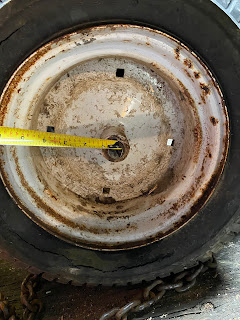 Measuring the distance between the holes in the rim to the axle