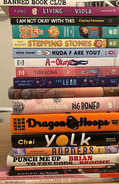 Top to bottom: Banned Book Club, Living with Viola, I Am Not Okay With This, Just Roll With It, Stepping Stones, Huda F Are You?, A-Okay, Tidesong, The Leak, The Beatryce Prophecy, Big Boned, Dragon Hoops, Yolk, Borders, Punch Me Up to the Gods, Milo Imagines the World, Migrants, Making a Great Exhibition, and It Fell From the Sky