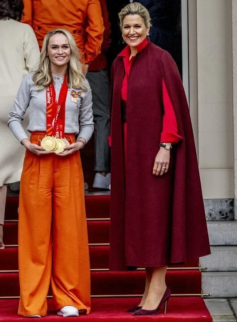 Queen Maxima wore a wool and cashmere-blend cape by Valentino, and wool crepe dress by Natan