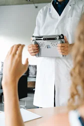 A doctor using an iPad in a case as a scanner.