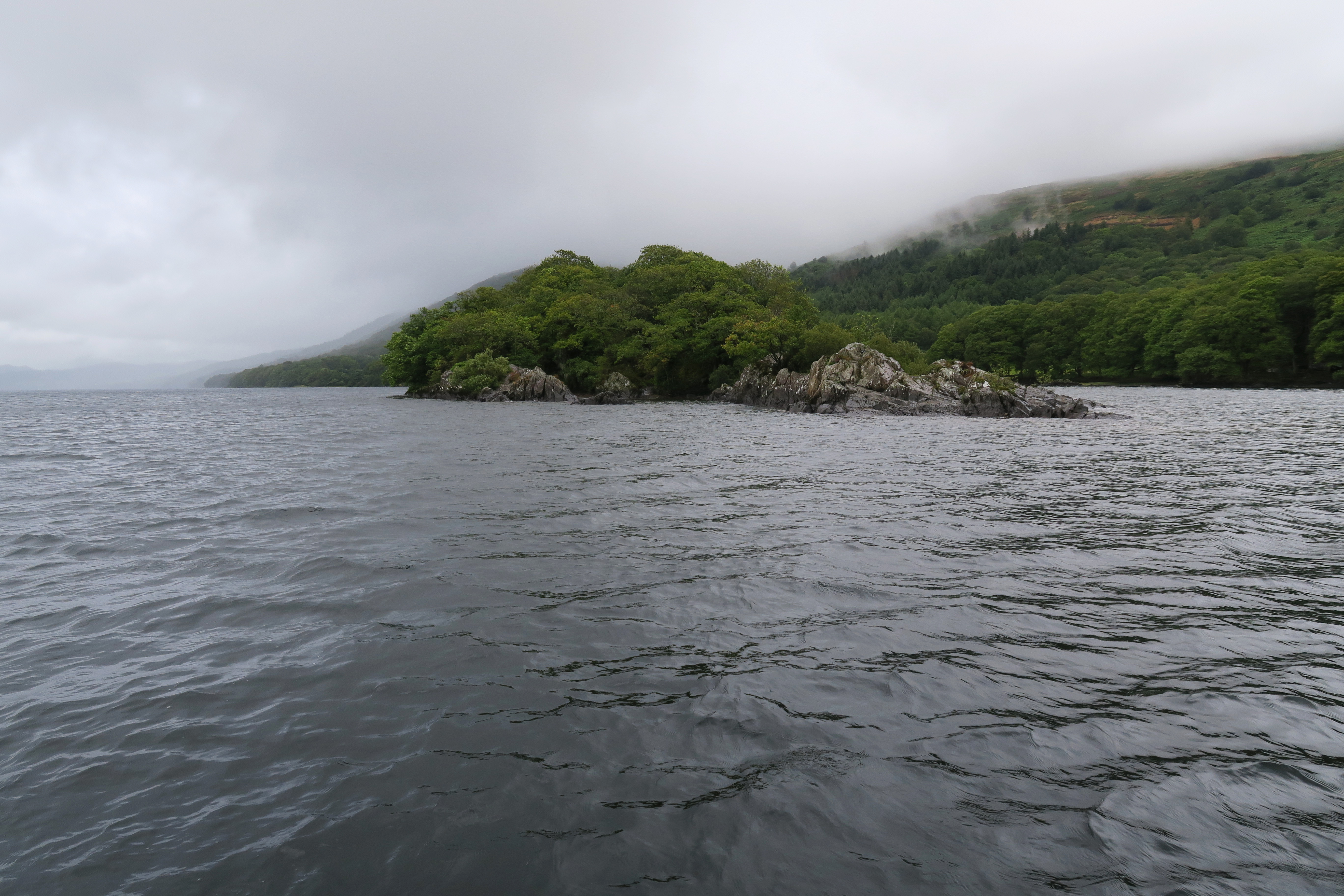 Looking across Coniston Water to Wild Cat Island, the small Island featured in the book Swallows and Amazons