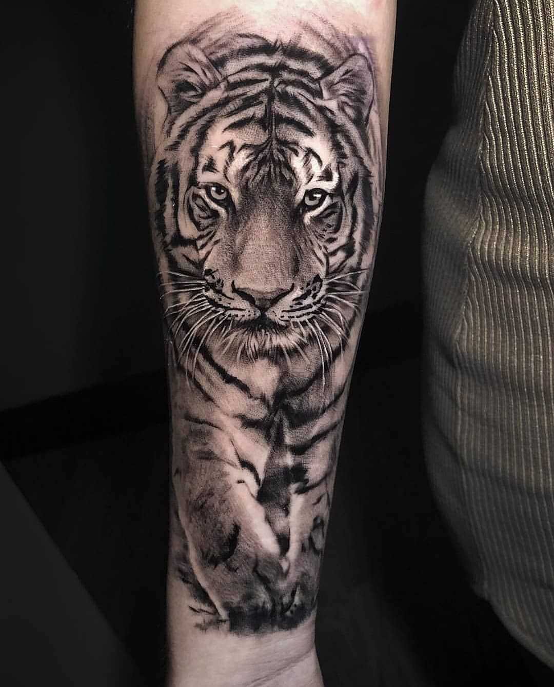A tiger tattoo can symbolize the outdoors or a special someone in your life. A tiger with cubs may symbolize a relationship.