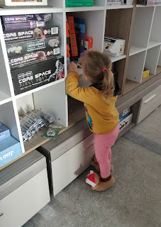 Rosie helping to put the cars away