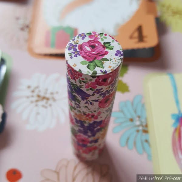 top of floral cardboard lipstick case