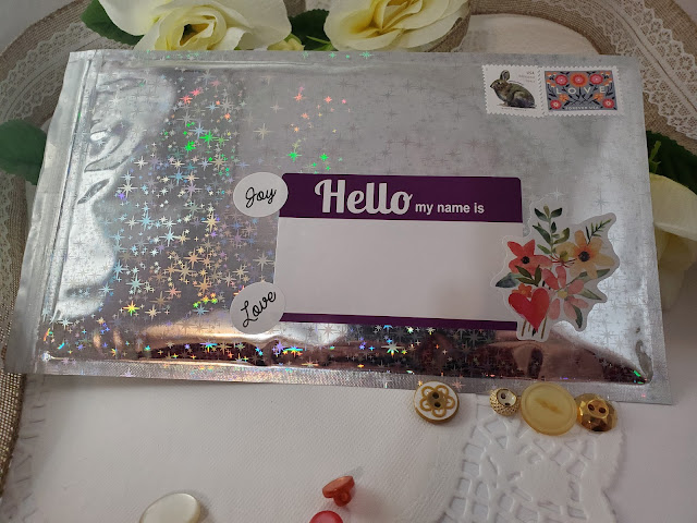 Back of shiny pipsticks packaging envelope with a name tag used as mailing lable.