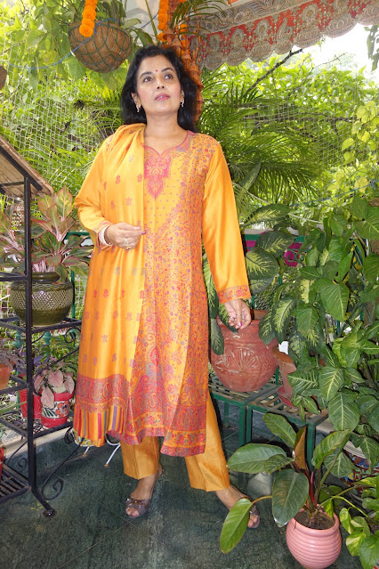 Golden yellow kani suit with dupatta. We have a range of these available.