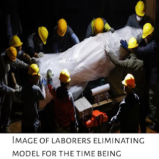 Image of laborers eliminating model for the time being