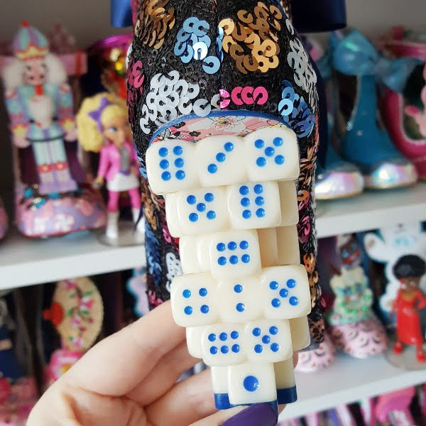 Irregular Choice dice concept heel close up with shoe shelves in background