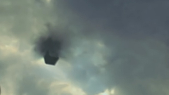 Cube UFO was literally coming out of the clouds.