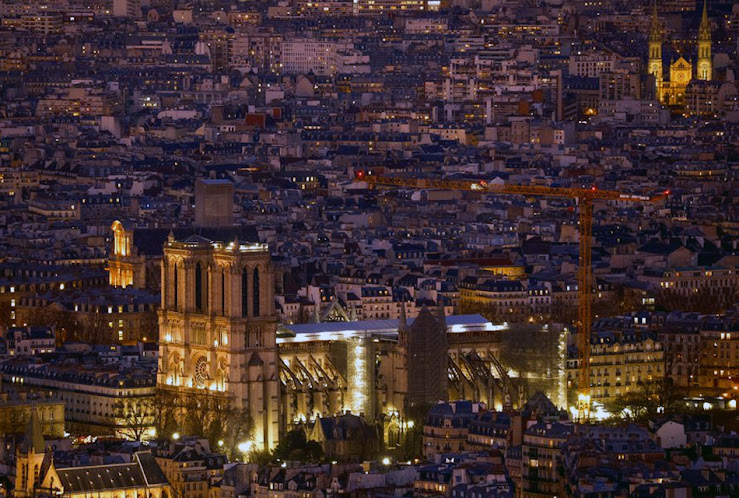 A view of a massive crane near the Notre-Dame de Paris Cathedral in Paris, France, as work continues to replace the roof and spire that were devastated by fire.